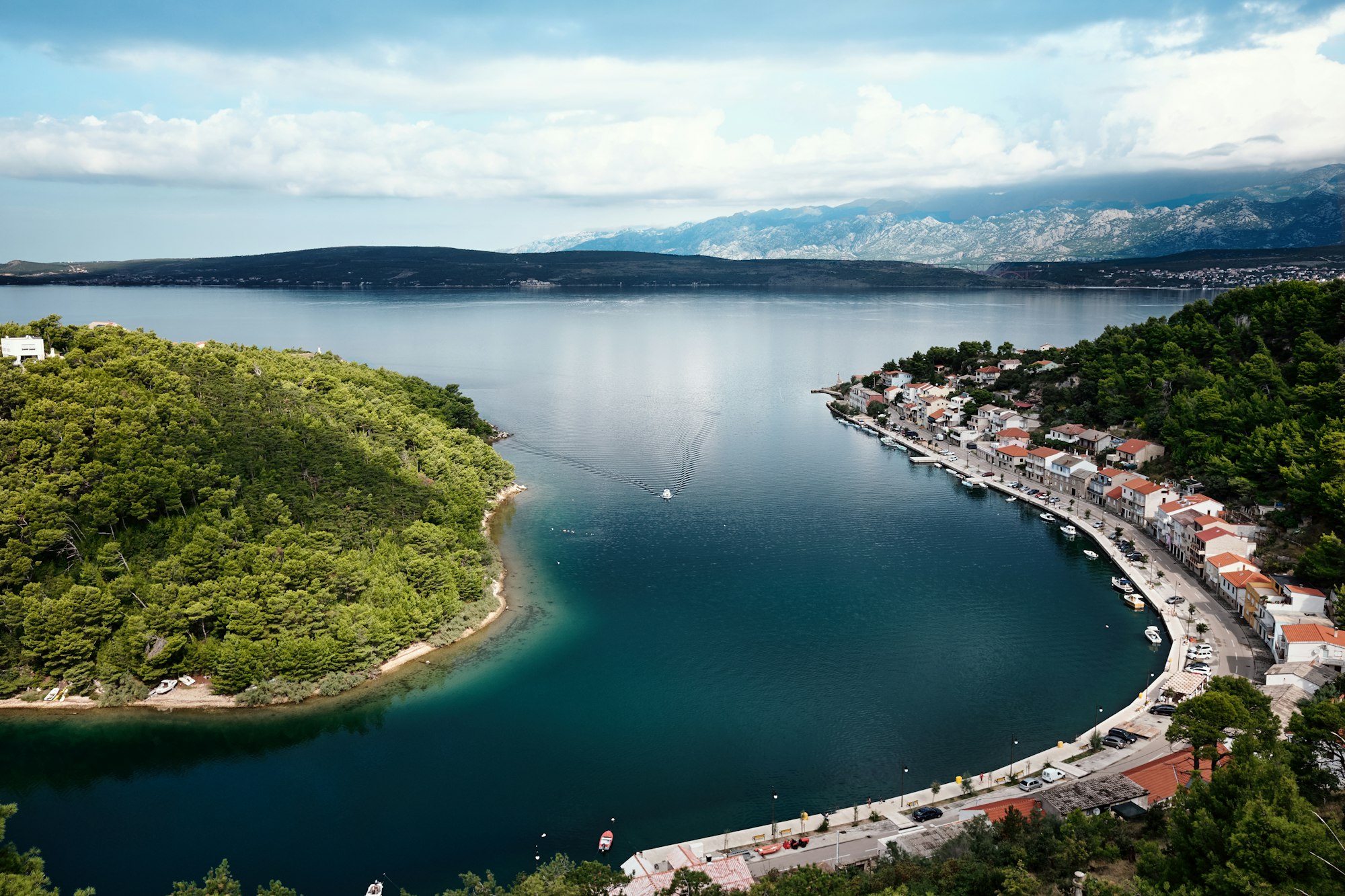 Aerial view of the Dalmatian coast and a harbour town beneath the Velebit mountains